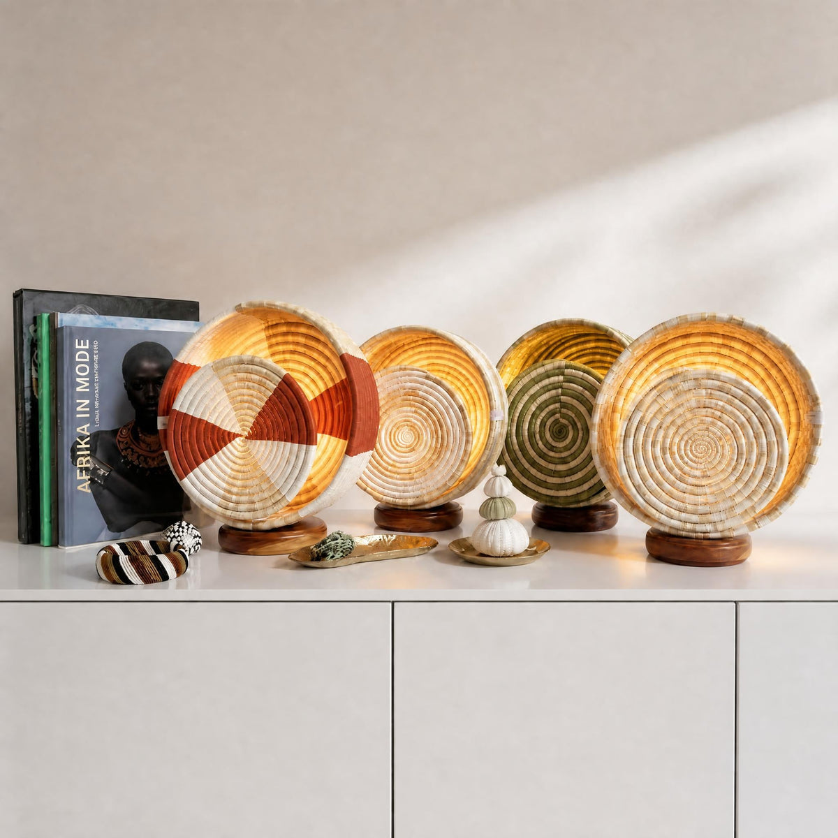 Set of moon-shaped lamps with spiral patterns on a dark background