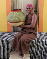 Basket weaver from Northern Ghana with her work