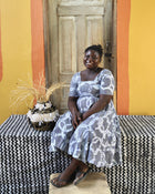 Ghanaian artisans with small basket made from Elephant grass and upcycled fabric 